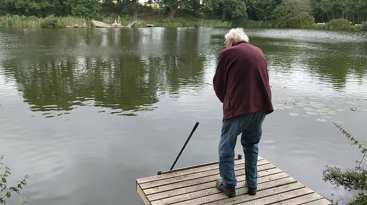 George Newsome Landing A Mirror Carp On The Feeder