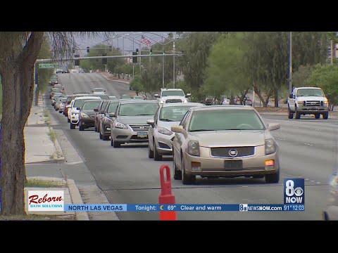 Long lines form for free food, gas cards at  food bank