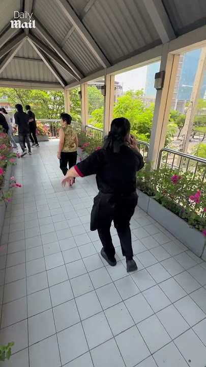 Horrified onlookers flee as Bangkok building collapses