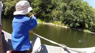 Boy catches fish on the Bogachiel River- Washington State