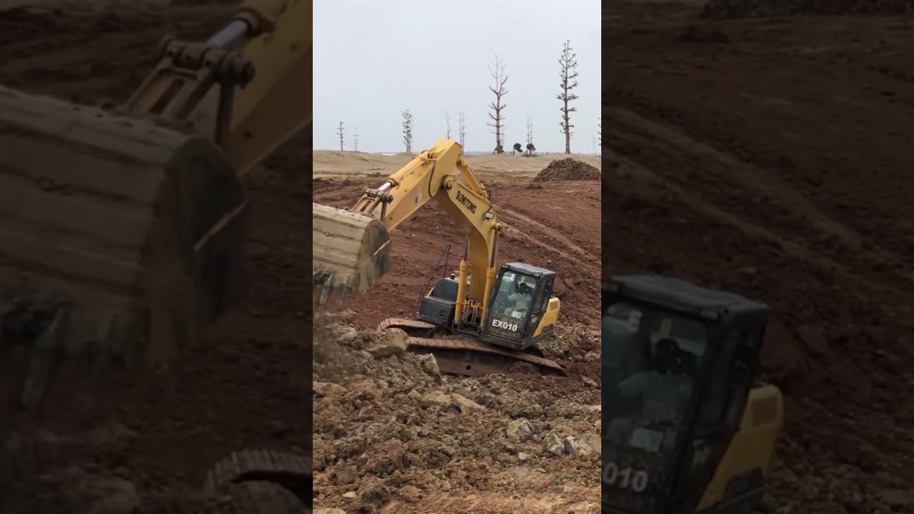 Submitomo SK210 Excavators Working Preparing Slop Protection Lake Construction.