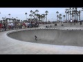 9 year old kid rocking the bowl at the Venice Beach skatepark.