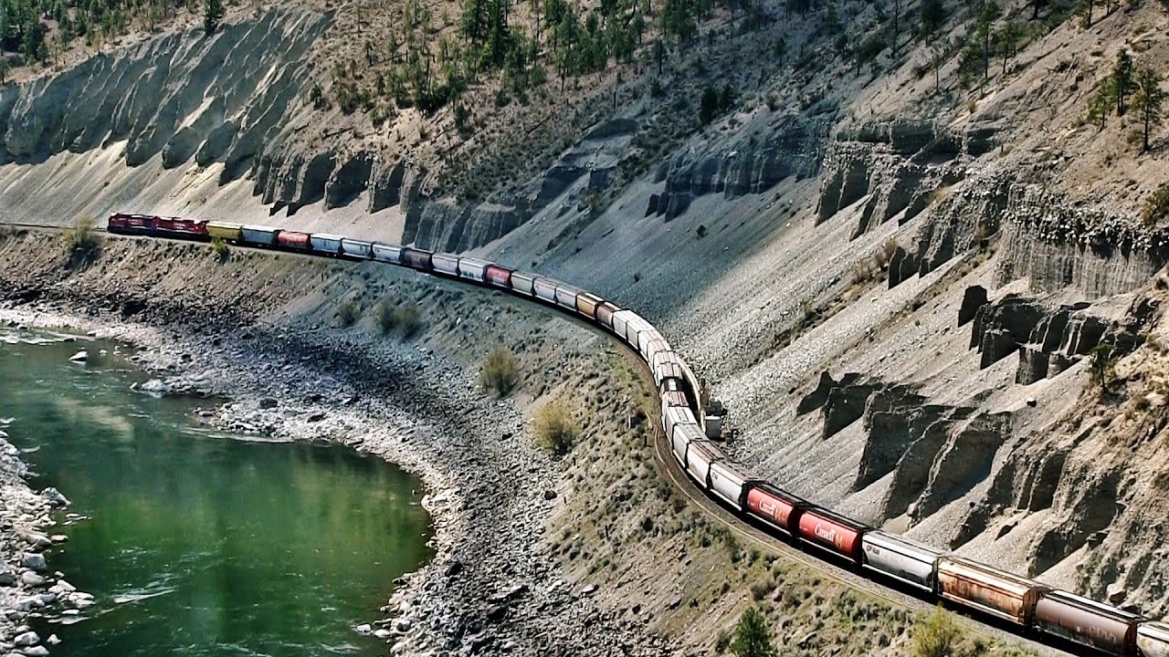 Huge Canadian Trains Meet Between The Thompson Canyon
