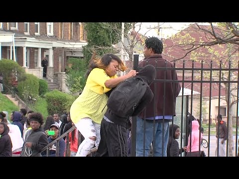 ORIGINAL: Mother drags son from Baltimore riots