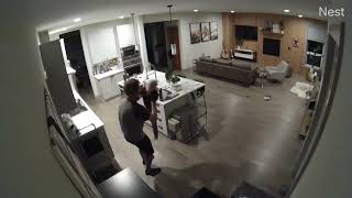 Little boy dances around kitchen then jumps and faceplants (Security camera)