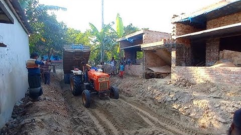 River sand is load on tractor by excavator & unload  by digital hydraulic System charming road side