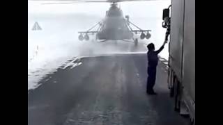 A MILITARY HELICOPTER STOPS TO ASK FOR DIRECTIONS IN THE MIDDLE OF THE ROAD !! ONLY IN RUSSIA !