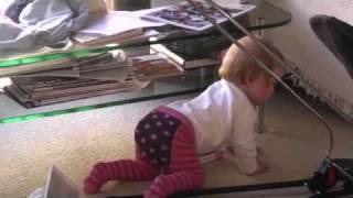 Abigail can crawl and reach up high