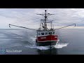 Fishing boat Razzo heading into port at Gloucester, Massachusetts. Beautiful drone footage.