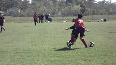 Jasmine Stovall running circles with soccer ball a...