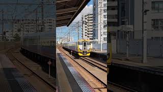 JR East E257-500 Express train passes Inage-kaigan station, Keiyo Line