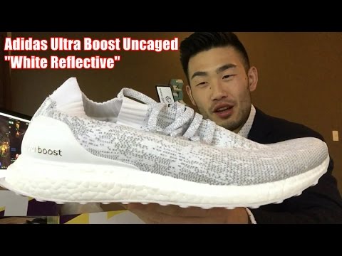 ultra boost uncaged white reflective on feet