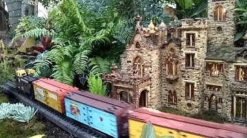 A Pennsylvania D Scale Holiday Train Passes Through A Holiday Show Community At NYBG