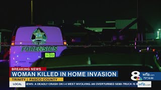 Masked man at large after breaking into home, killing woman in front of kids, officials say