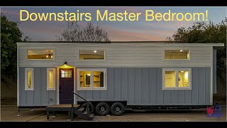 Downstairs master bedroom in this precious Tiny Home on Wheels