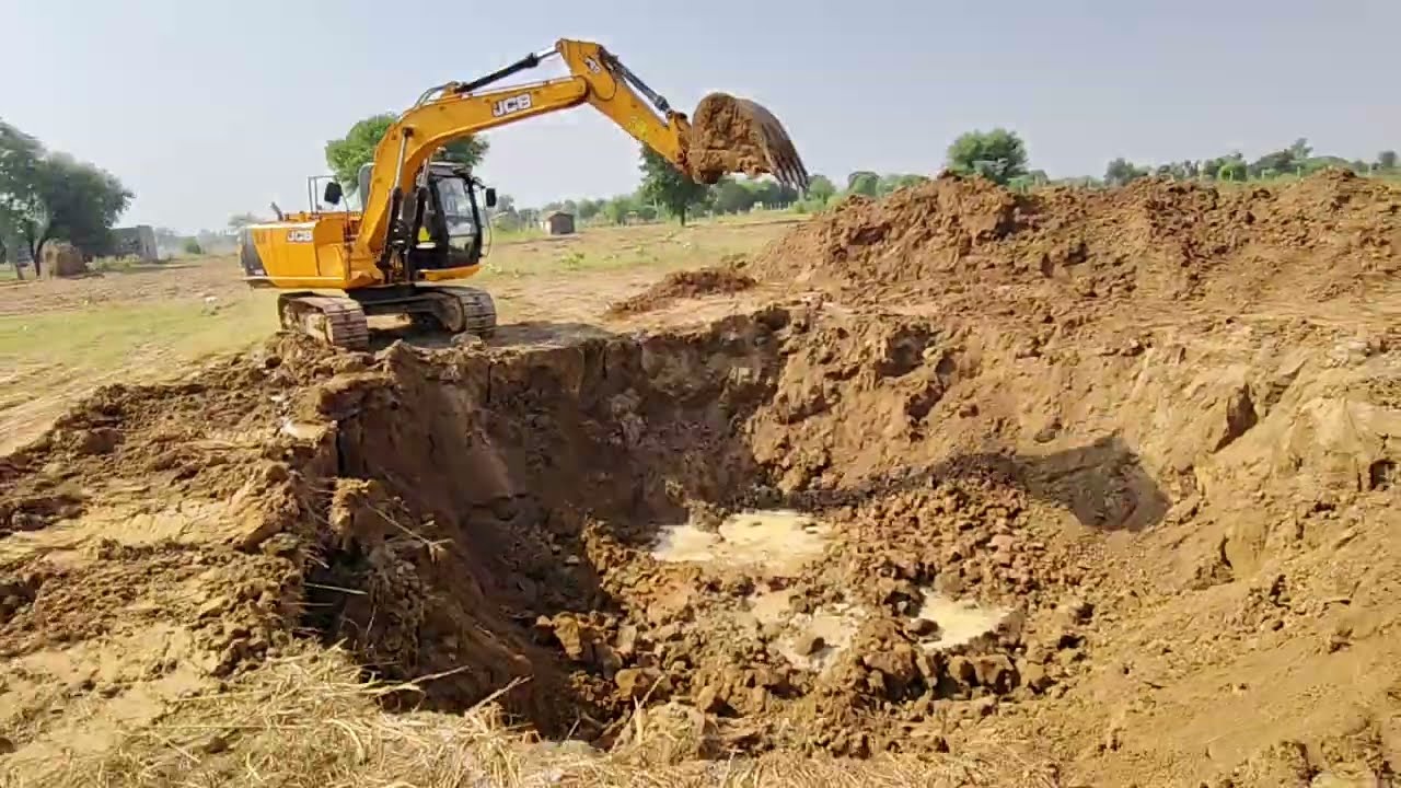 EXCAVATION OF WET SOIL BY EXVATOR  765 KV BAYAWAR TO DAUSA TL LINE