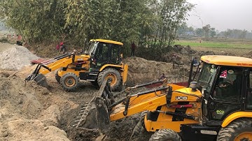 Two JCB Backhoe 3DX Machine Making A Bridge Foundation