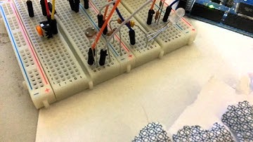 Two leds controlled by a photo resistor