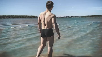 GIANT RIPPED 15 YEARS OLD MUSCLE BOY FLEXING AT THE BEACH