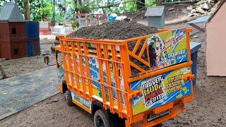 Truk Basuri Oleng Warna Orange Muat Tanah Lagi