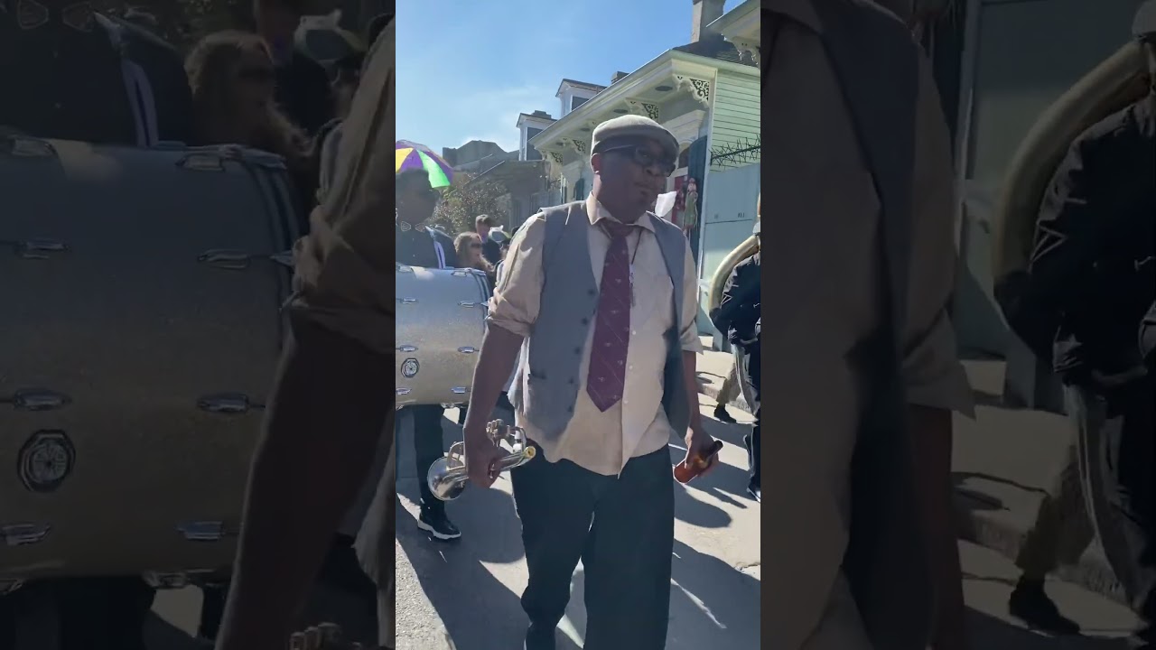 Preservation hall Brass Band Doing A Second line parade in the French Quaters 