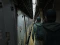 New York City subway station showing passengers waiting on platform for the train, glimpse into