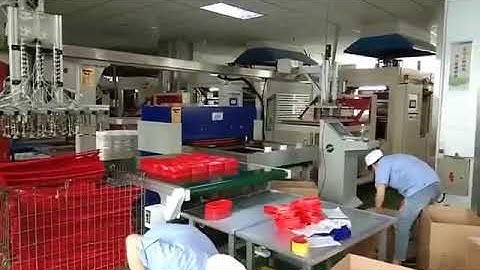 Cutting Machine with Robot arm picking up connecting with Semi-Auto thermoforming machine