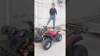 Chinese Woman Offloading Atv From A Pickup Truck