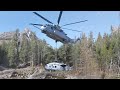 Gigantic US CH-53 Lifts Damaged Helicopter from Mountain Site