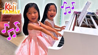 Emma and Kate Practice Their Piano Performance