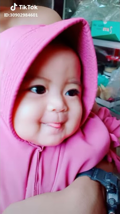 Oi Adek Berjilbab ungu