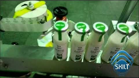Round bottle front back and top labeling machine SKILT Machinery
