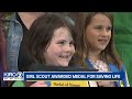 Young Girl Scout receives award for saving life