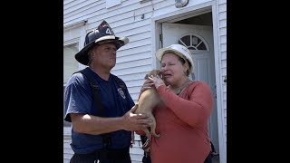 Woman tearfully reunited with dog after fire