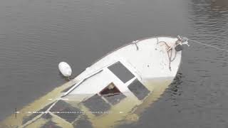 В Киеве посреди Днепра бросили затонувшую яхту: видео с высоты