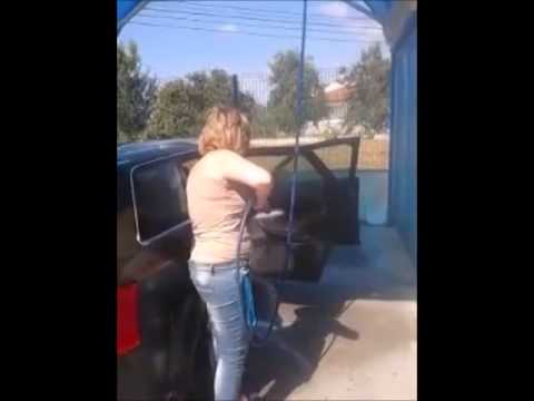 Woman Washes Car with doors open