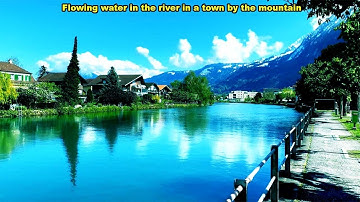 Med10 Scenic of the River in a Town by the Mountain / View of motor vehicles passing on the bridge