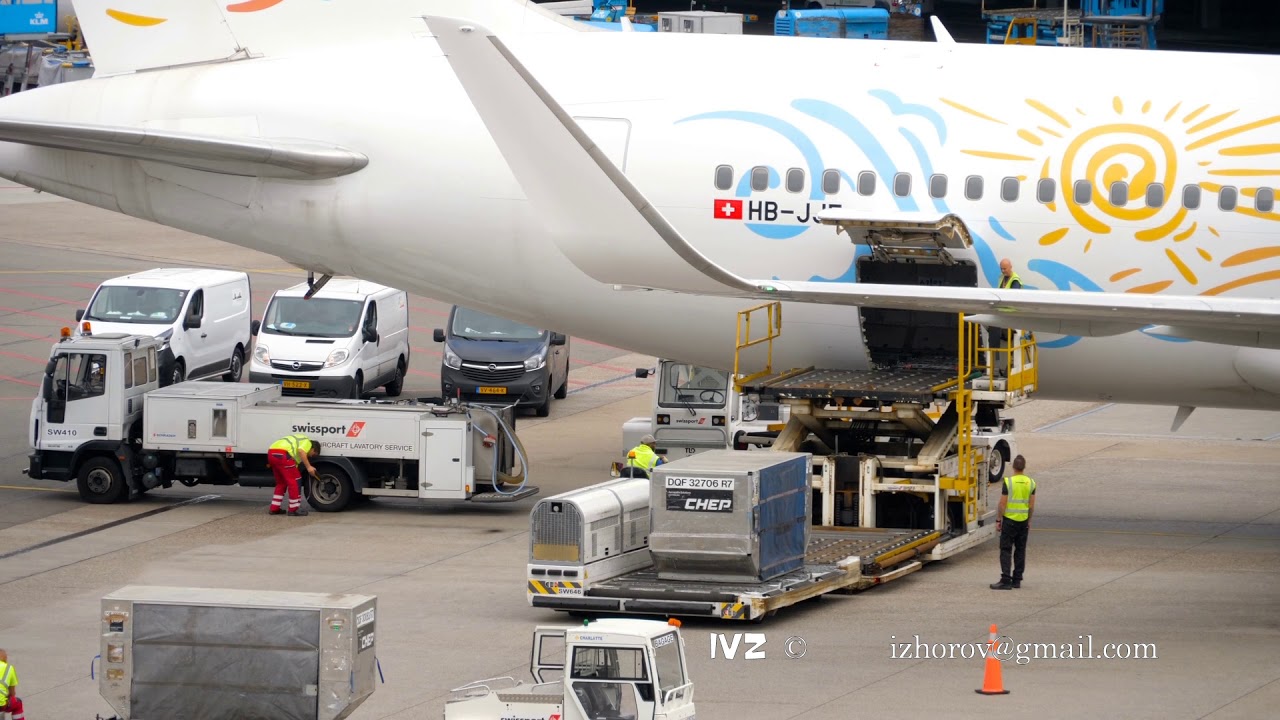 Unloading luggage containers from the aircraft YouTube