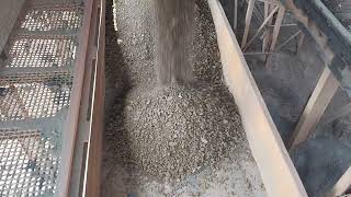 Iron ore lump loading in rail wagons with wagons moving