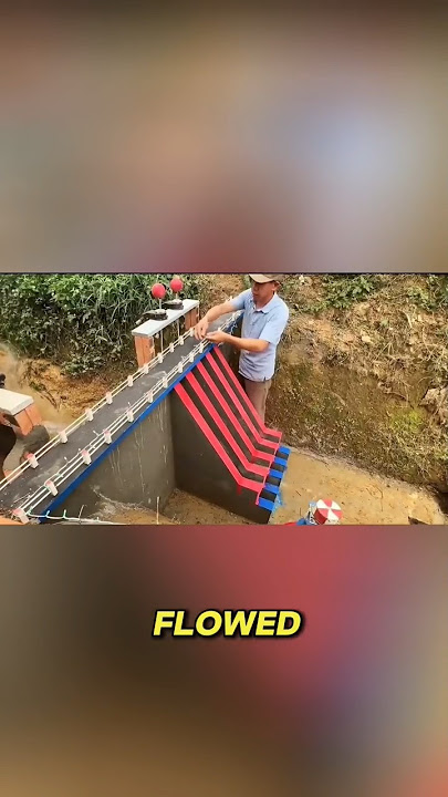 This man hand built hydroelectric  dam in a river gorge.
