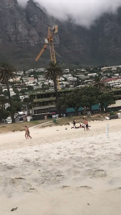 I am enjoying the stunning waves and scenery in Camps Bay, Cape Town.