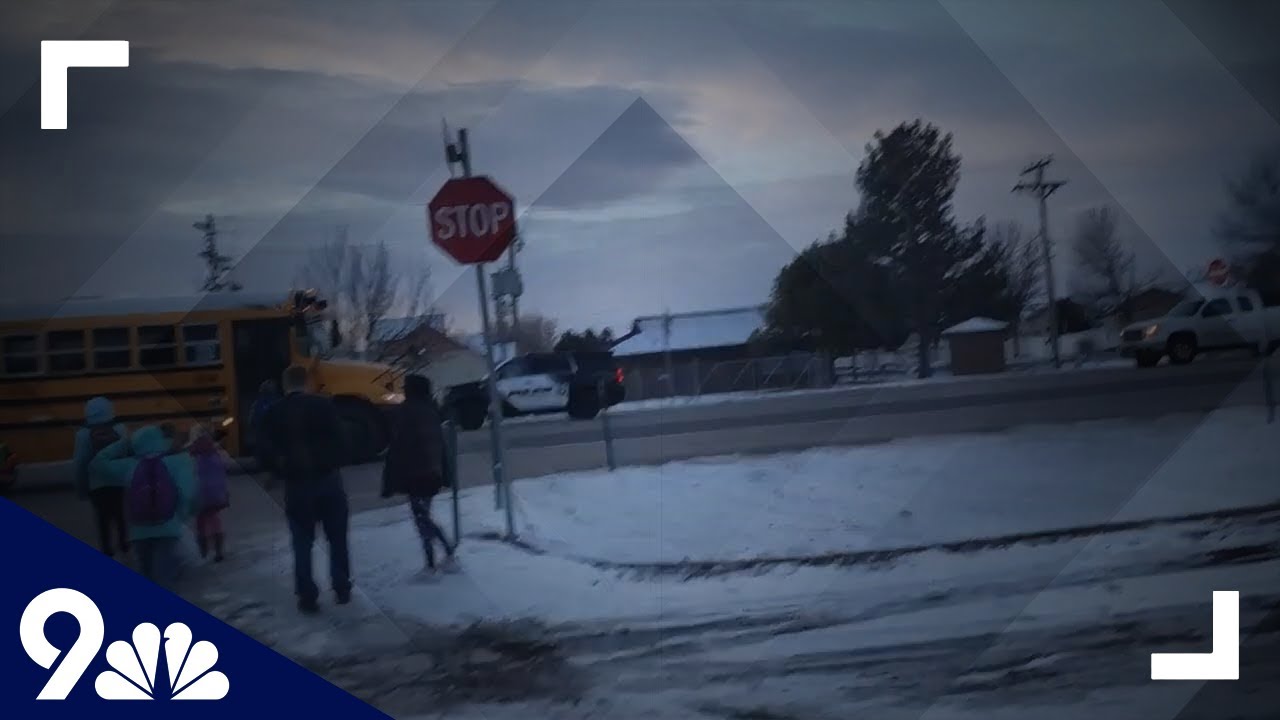 RAW: Video shows marked police car fail to stop for school bus