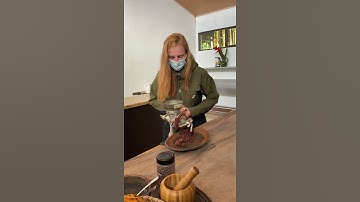 grinding the cacao beans