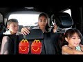 Kids drive thru in the car taking food