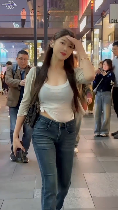 Beautiful girl wearing jeans attracts attention