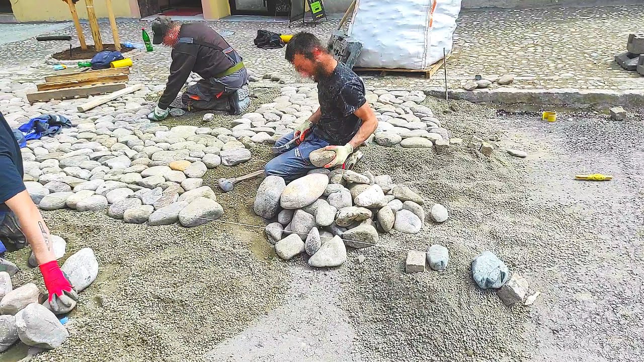 Укладка булыжника - как камень используется для мощения улиц - мощеных подъездных путей и дорожек