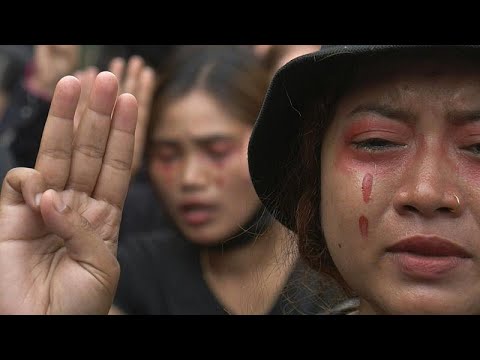 Crying and song as Myanmar anti-coup protesters don red 