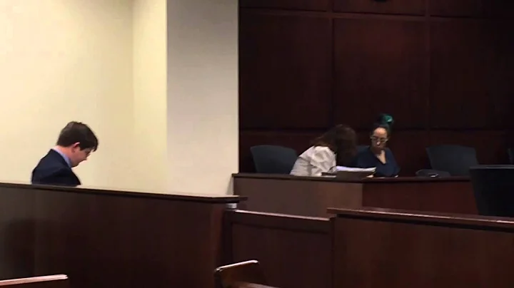 Accused husband-killer confers with lawyer