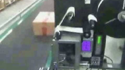 Label Printer Applicator applying labels to the side of a box