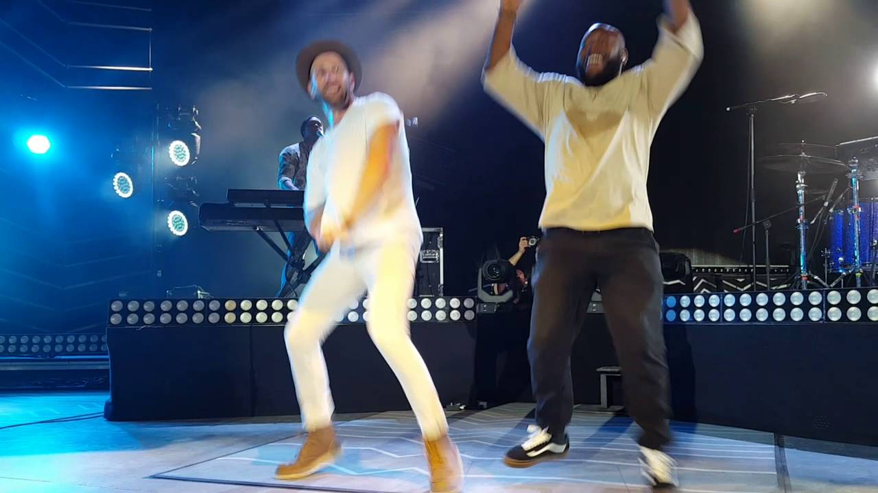 Matt Kearney dancing and bass player back flip at the Greek Theater in